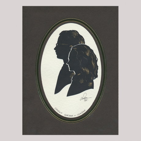 
        Silhouette with two boys, looking left. Close-up the girl; in the background the boy wearing glasses.